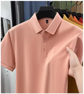 Close-up of premium men's pink polo shirt showing the fabric stretch and soft texture