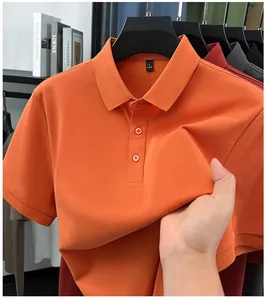 Close-up of premium orange men's polo shirt showing elastic and breathable fabric