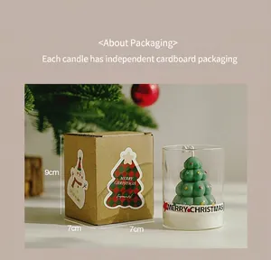 Detailed view of Christmas tree scented candle in glass with 9x7cm gift box packaging