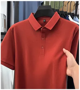Close-up of premium red men's polo shirt showing fabric texture and collar detail.