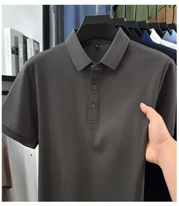 Detailed macro view of a grey men's polo shirt fabric showing elasticity and texture.
