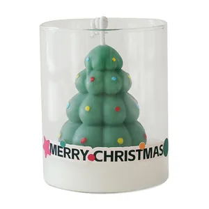 Elegant Christmas tree scented candle in a clear glass cup with Merry Christmas label