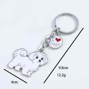 Close-up of white Maltese cartoon dog keychain showing 4cm and 9.8cm dimensions