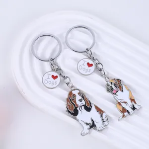 Two cartoon pet dog keychains with 'I Love Dogs' heart charms on white background