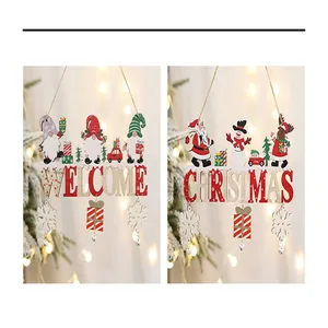 Two Christmas wooden hanging signs featuring 'WELCOME' and 'CHRISTMAS' text.