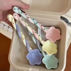 Set of 4 cute pastel ceramic dessert spoons with twisted handles and flower shaped heads for coffee
