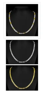 Detail view of men's stainless steel necklaces in gold, silver, and two-tone finishes