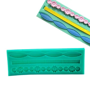 Detail view of silicone border mold featuring floral and geometric patterns for cake decor.