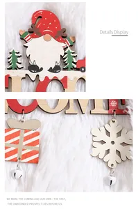 Close-up detail of a decorative Christmas wooden door sign with gnome, gift box and bells