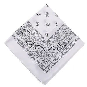 Detail shot of white square bandana with classic black paisley pattern for outdoor cycling