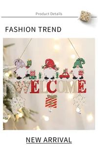 Detailed macro view of the festive wooden welcome sign with gnomes and hanging bells