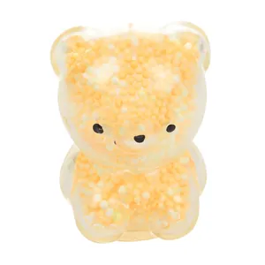 Detailed view of a cute gummy bear squishy toy filled with yellow foam beads