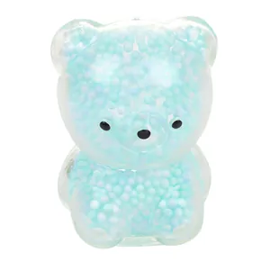 Macro view showing texture of blue foam beads inside a cute transparent bear squishy toy