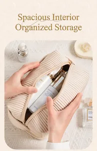 Detail view of the cream pleated PU cosmetic bag showing spacious interior for bottles
