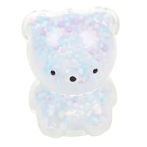 Detail of cute bear squishy toy filled with colorful blue and purple foam beads