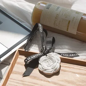 Elegant rose shaped white plaster fragrance stone for closet with black ribbon hanger