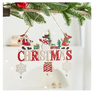 Close-up of wooden Christmas hanging sign with Santa, snowman and reindeer figures
