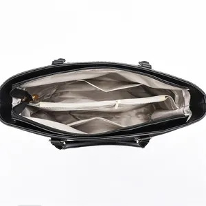 Internal view of a black high-capacity handbag with multiple storage compartments