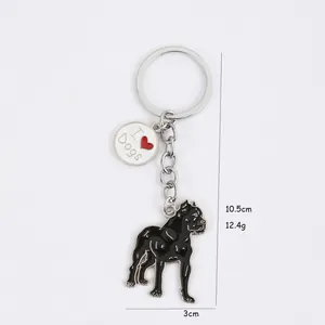 Detailed view of a black dog keychain showing dimensions 10.5cm by 3cm and 12.4g weight.