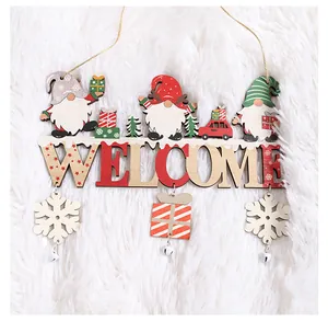 Detail showing a wooden Christmas Welcome door sign with gnomes, snowflakes and bells