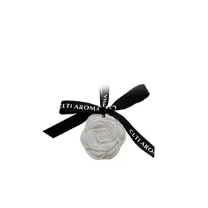 Elegant white rose-shaped gypsum aroma stone with black CLTI AROMA hanging ribbon for home