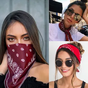 Red multi-functional paisley bandana scarf shown as face mask, necktie and headband