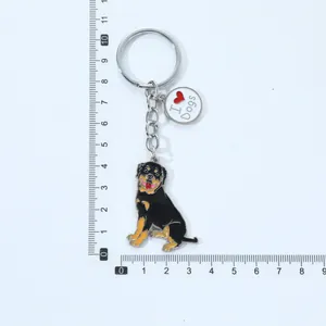 Detailed Rottweiler dog keychain with I Heart Dogs charm next to a measuring ruler