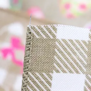 Macro detail of Easter plaid ribbon with wired edge and fine serged stitching for gift bows