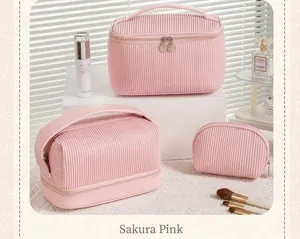 Set of three pink pleated waterproof PU makeup bags for travel cosmetic storage