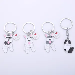 Detailed macro view of zinc alloy cartoon dog and cat keychain pendants with enamel finish