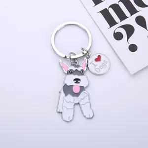 Detailed view of zinc alloy cartoon Schnauzer dog keychain with heart charm tag