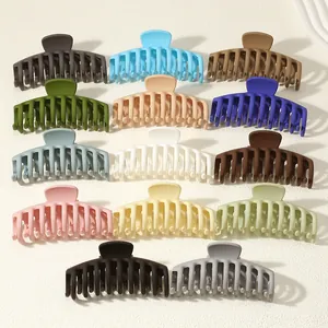 Collection of large matte hair claw clips in various colors for thick hair styling