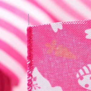 Detailed macro view of pink Easter ribbon featuring serged edges and thin wire for easy shaping