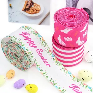 Close-up of Easter wired ribbons with bunny, egg patterns and Happy Easter text