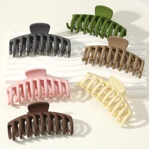 Set of six large matte square hair claw clips in earthy and pastel tones for women