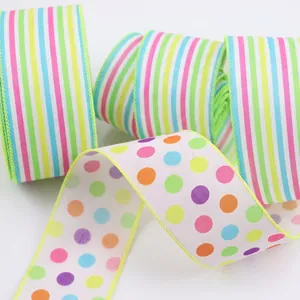 Detailed view of colorful striped and polka dot wire-edged ribbons for Easter gift decor