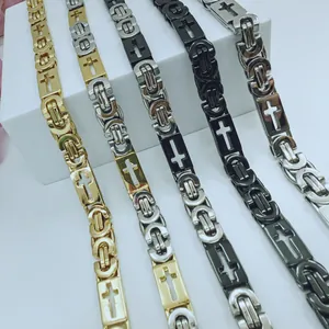 Macro detail of stainless steel men's necklaces with unique cross cut-out design