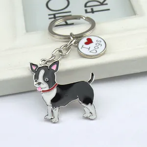 Detailed view of Boston Terrier enamel dog keychain with small circular I Love Dogs charm tag.