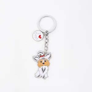 Close-up detail of a cute cartoon dog keychain with an I Love Dogs round metal charm