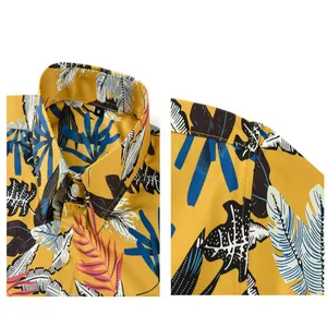 Macro view showing the collar and fabric texture of a yellow floral beach shirt for men