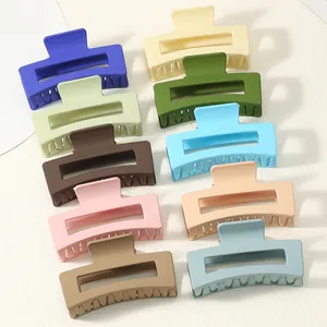 Detail view of 10 matte square hair claw clips in assorted pastel colors