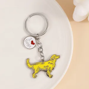 Detailed view of the yellow golden retriever dog keychain with an 'I love dogs' charm.