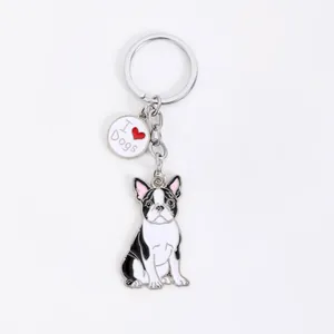 Close-up detail of a French Bulldog metal keychain with a cute "I Love Dogs" charm.