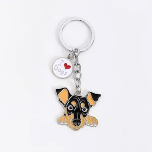 Detailed close-up of a cartoon dog enamel keychain featuring an I Love Dogs round charm.