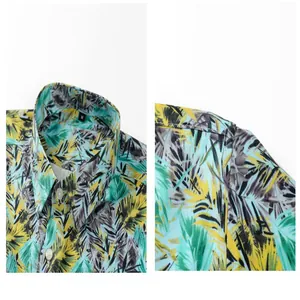 Detail view of the collar and tropical leaf print on this men's Hawaiian beach shirt.