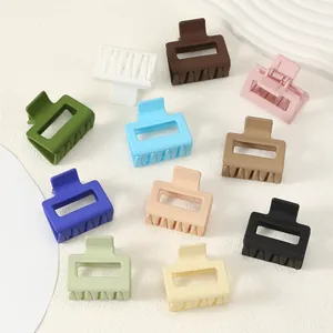 Detailed view of colorful matte square hair claw clips in various pastel and bold shades