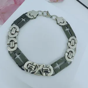 Detail view of men's stainless steel necklace with hollow cross pattern links.