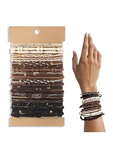 Set of Bohemian style elastic hair bands and bracelets in neutral earth tones and textures.