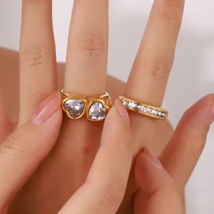 Elegant gold ring set featuring a double heart zircon design and a channel-set band.