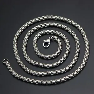Macro detail view of a durable silver stainless steel box chain with a secure clasp